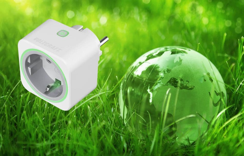 Environment concept, glass globe in the grass